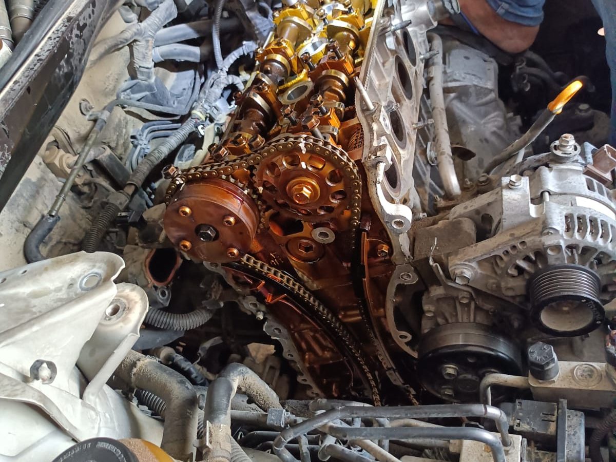Car mechanic fixing car engine issue